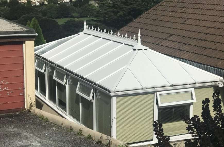 Conservatory with a transparent insulated roof