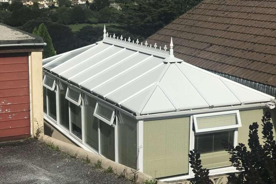 Conservatory with a transparent insulated roof