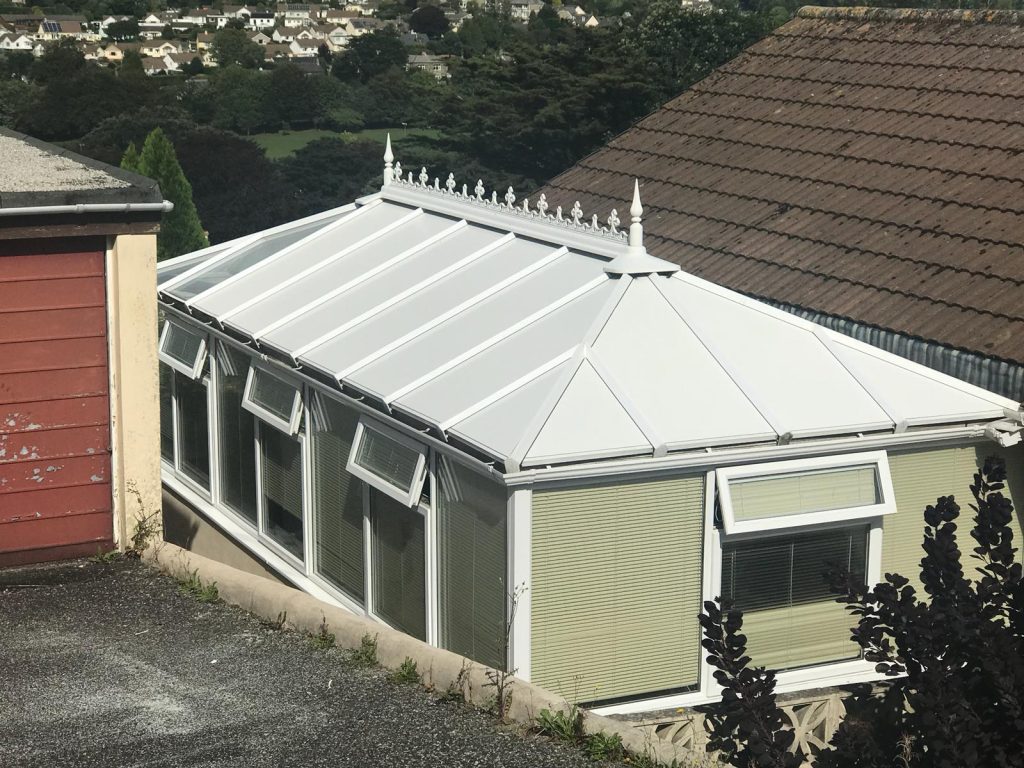 Modern conservatory with insulated panel roofing